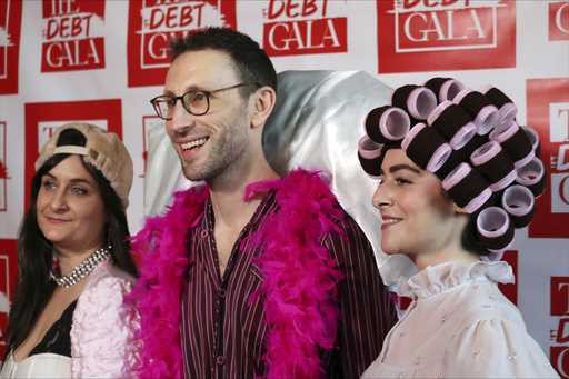 Debt Gala co-founders, from left, Molly Gaebe, Tom Costello and Amanda Corday, appear at the Debt G…