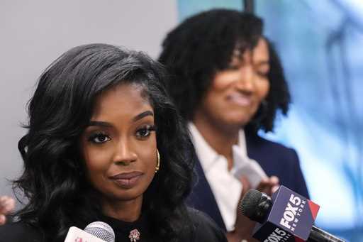 Arian Simone, left, and Ayana Parsons, right, of the Fearless Fund, attend a news conference, Augus…