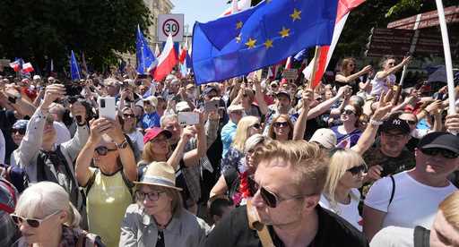 Participants join an anti-government march led by the centrist opposition party leader Donald Tusk,…