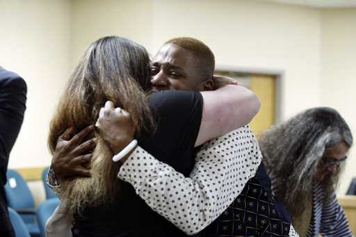Eric Posey, of Post Falls, Idaho, embraces a supporter in court after a jury awarded him more than …