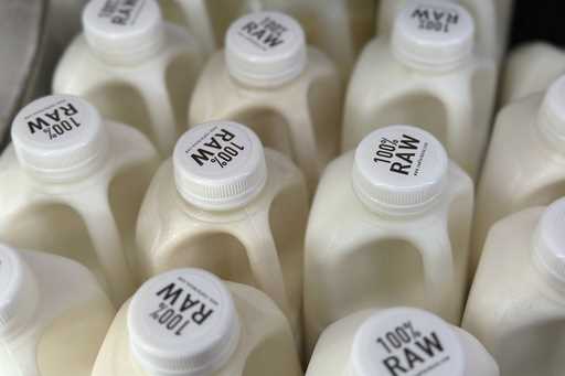 Bottles of raw milk are displayed for sale at a store in Temecula, Calif