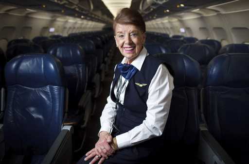 Flight attendant Bette Nash poses on a plane at Logan International Airport in Boston on December 1…