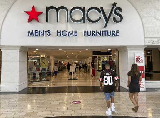 Shoppers walk into a Macy's department store Monday, February 22, 2021, at Miami International Mall…