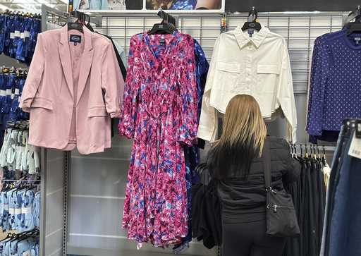 A shopper looks at clothes at a Walmart store in Secaucus, N