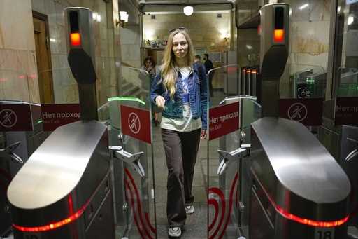 Yekaterina Maksimova enters a Moscow subway station in Moscow, Russia, Monday, May 22, 2023