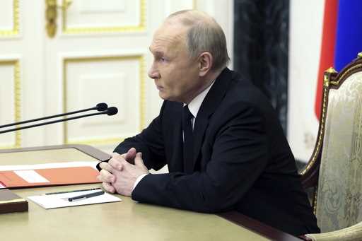 Russian President Vladimir Putin chairs a Security Council meeting in Moscow, Russia, Thursday, Apr…