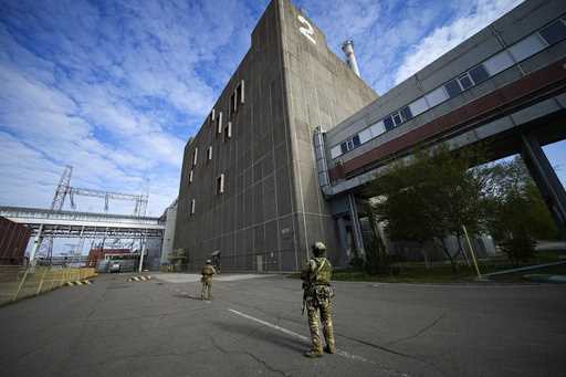 Russian servicemen guard an area of the Zaporizhzhia Nuclear Power Station, the largest nuclear pow…