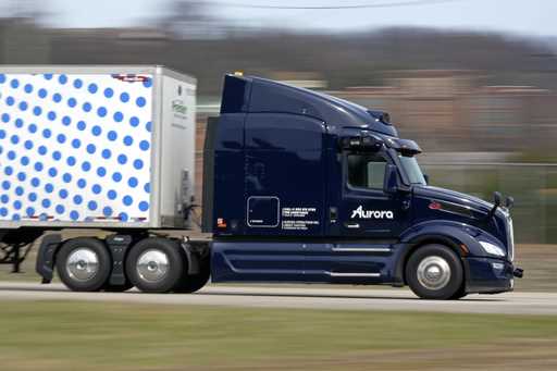 A self-driving tractor trailer maneuvers around a test track in Pittsburgh, Thursday, March 14, 202…
