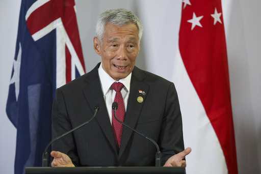 Singapore Prime Minister Lee Hsien Loong gestures during a joint press conference with Australian P…