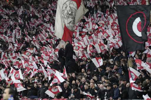 Ajax's supporters react at the stand before the Europa Conference League round of 16 first leg socc…