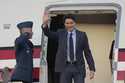 Canadian Prime Minister Justin Trudeau waves upon his arrival at the Seoul airport in Seongnam, Sou…