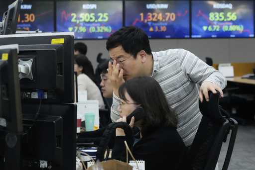 Currency traders watch monitors at the foreign exchange dealing room of the KEB Hana Bank headquart…