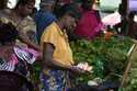 FILE- Street hawkers open up their business for the day at a market place in Colombo, Sri Lanka, No…