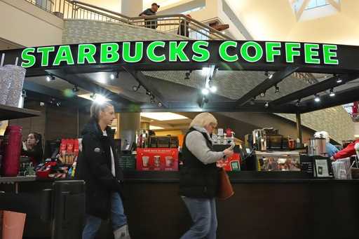 Shoppers at the Walden Galleria in Buffalo, NY, stop by the Starbucks kiosk on Saturday, November 3…