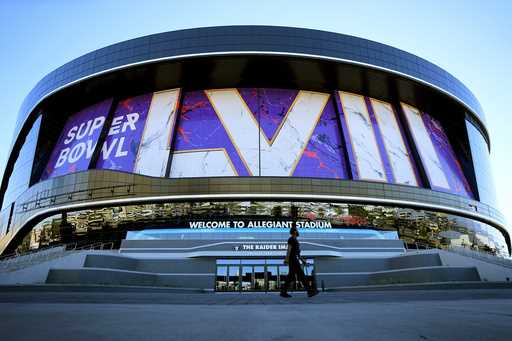 A worker walks in front of Allegiant Stadium in advance of Super Bowl 58, Tuesday, January 30, 2024…