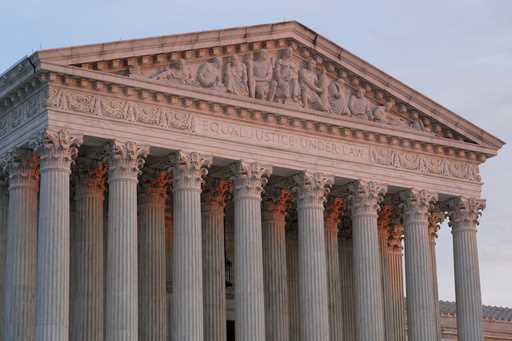 The setting sun illuminates the Supreme Court building on Capitol Hill in Washington, January 10, 2…