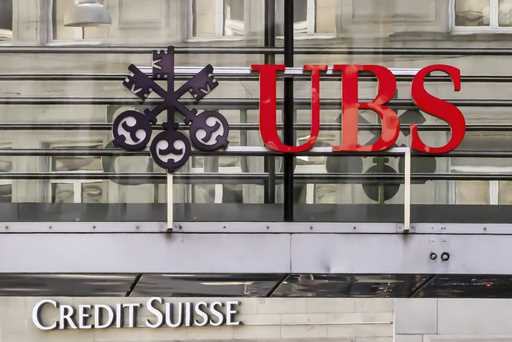 Logos of the Swiss banks Credit Suisse and UBS are seen on two buildings in Zurich, Switzerland, Sa…