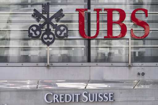 The logos of the Swiss banks Credit Suisse and UBS are pictured in Zurich, Switzerland, June 12, 20…
