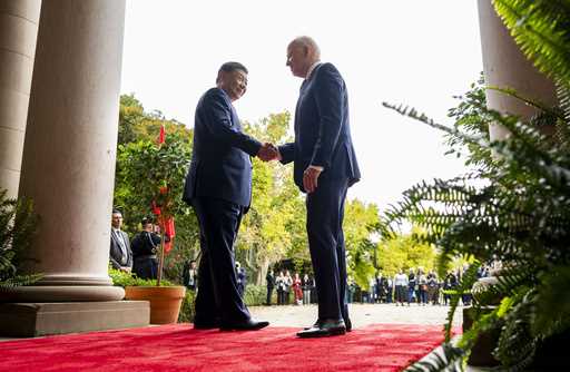 FILE -President Joe Biden, right, greets China's President President Xi Jinping, left, at the Filol…