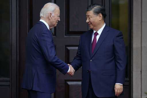 President Joe Biden, left, greets China's President President Xi Jinping, right, in Woodside, USA, …