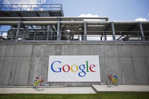 FILE -- A banner hangs during a ceremony announcing a proposed $300 million expansion of Google's d…