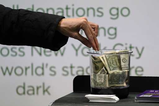 Money is donated for out of work musicians on March 18, 2021, in New York