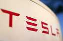 The logo for the Tesla Supercharger station is seen in Buford, Ga, April 22, 2021