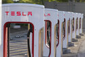 FILE -This April 22, 2021, photo shows a Tesla Supercharger station in Buford, Ga