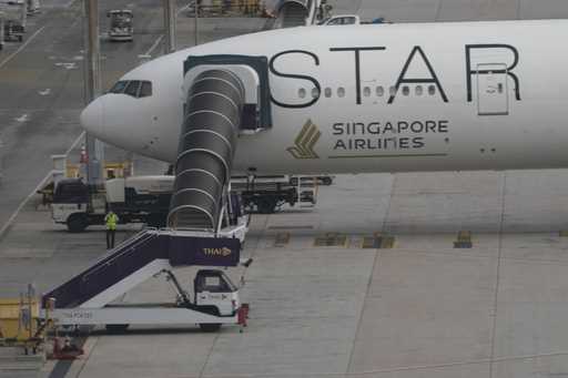 The Boeing 777-300ER aircraft of Singapore Airlines, is parked after the SQ321 London-Singapore fli…
