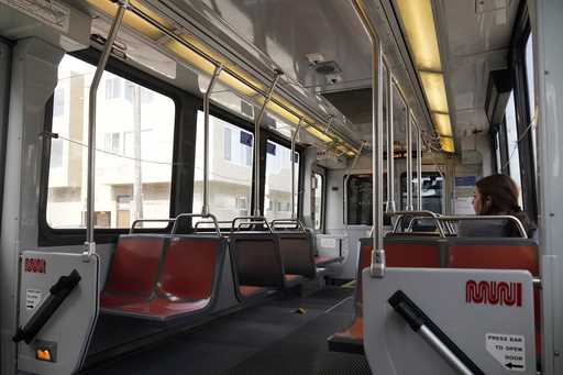 A passenger rides a mostly empty Muni streetcar in San Francisco, Tuesday, June 6, 2023