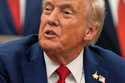 President Donald Trump speaks in the Oval Office of the White House before signing an executive ord…