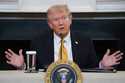 President Donald Trump answers questions from reporters during a roundtable on criminal cartels in …