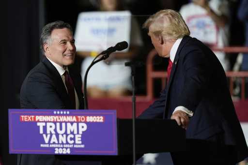 Republican Pennsylvania Senate candidate David McCormick, left, walks on stage to greet Republican …