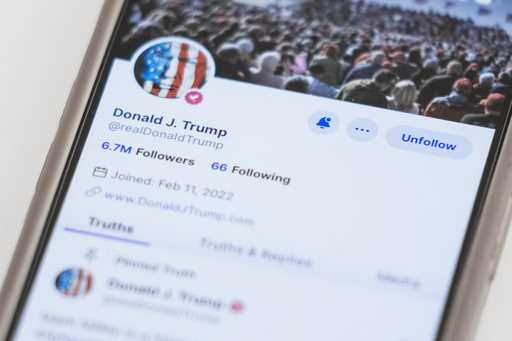 The Truth Social account for former President Donald Trump is seen on a mobile device, Wednesday, M…