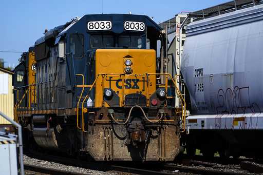 A CSX train engine sits idle on tracks in Philadelphia, Wednesday, Sept