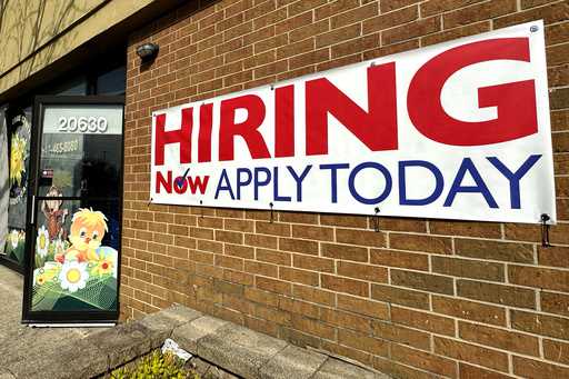 A hiring sign is displayed in Riverwoods, Ill