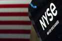 An NYSE sign is seen on the floor at the New York Stock Exchange in New York, Wednesday, June 15, 2…