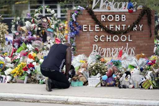 Reggie Daniels pays his respects a memorial at Robb Elementary School, Thursday, June 9, 2022, in U…