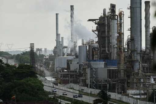 Vehicles drive past the El Palito refinery in Puerto Cabello, Venezuela, Sunday, December 21, 2025
