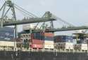 Containers are loaded on a ship at the Saigon port in Ho Chi Minh City, Vietnam on May 3, 2020