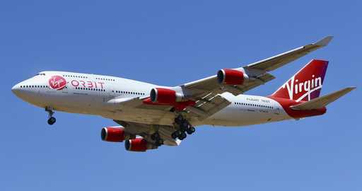 A Virgin Orbit Boeing 747-400 aircraft named Cosmic Girl prepares to land back at Mojave Air and Sp…