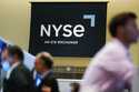 An NYSE sign is seen on the floor at the New York Stock Exchange in New York, Wednesday, June 15, 2…