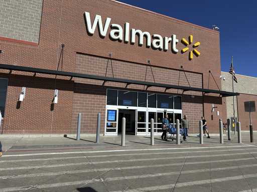 Shoppers exit a Walmart store, February 21, 2024, in Englewood, Colo