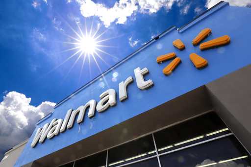 A Walmart sign is displayed over the entrance to a store, June 25, 2019, in Pittsburgh