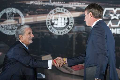 Ted Leonsis, left, owner of the Washington Wizards NBA basketball team and the Washington Capitals …