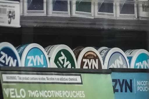 Containers of Zyn, a Phillip Morris smokeless nicotine pouch, are displayed for sale among other ni…