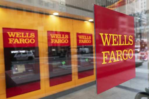 A Wells Fargo bank sign hangs outside a window on January 13, 2021, in New York