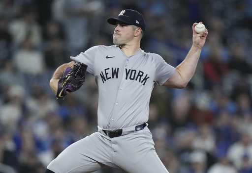 New York Yankees pitcher Carlos Rodon works against the Toronto Blue Jays during the first inning o…