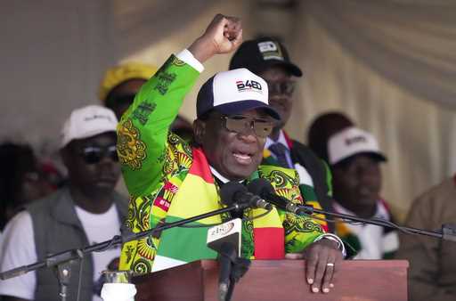 Zimbabwean President Emmerson Mnangagwa greets party supporters at a campaign rally in Harare, Wedn…