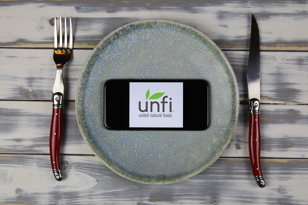 United Natural Foods stock logo on plate